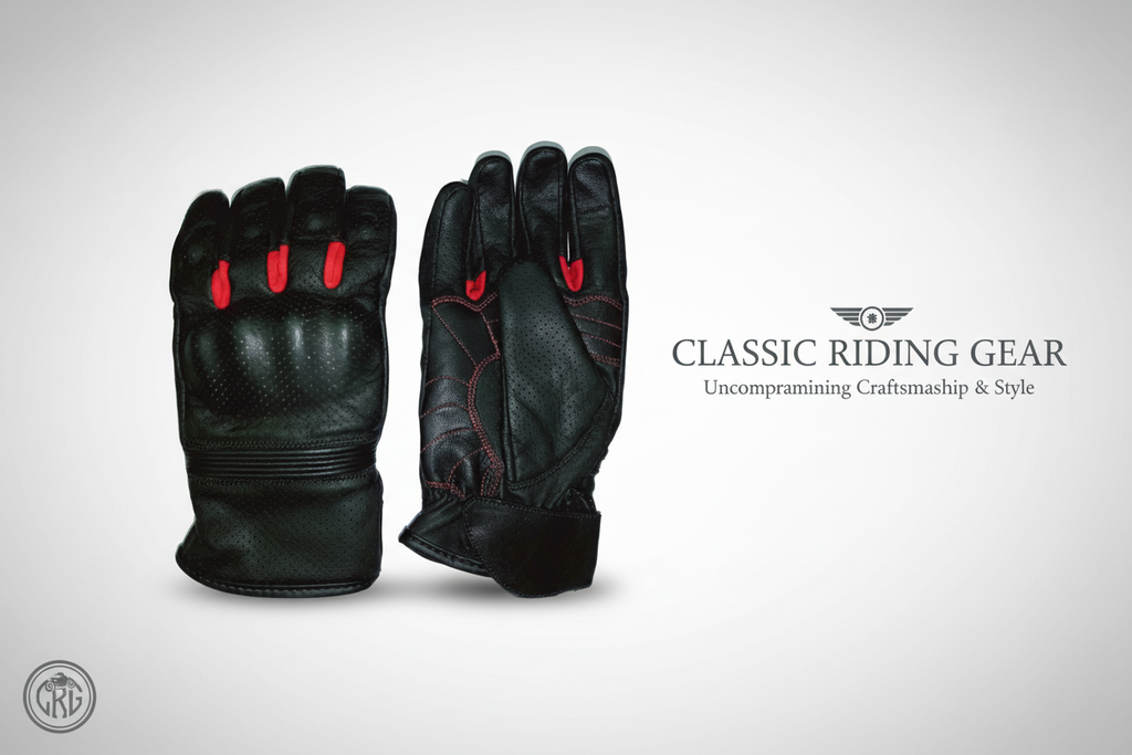 Black leather gloves with red accents on a white background